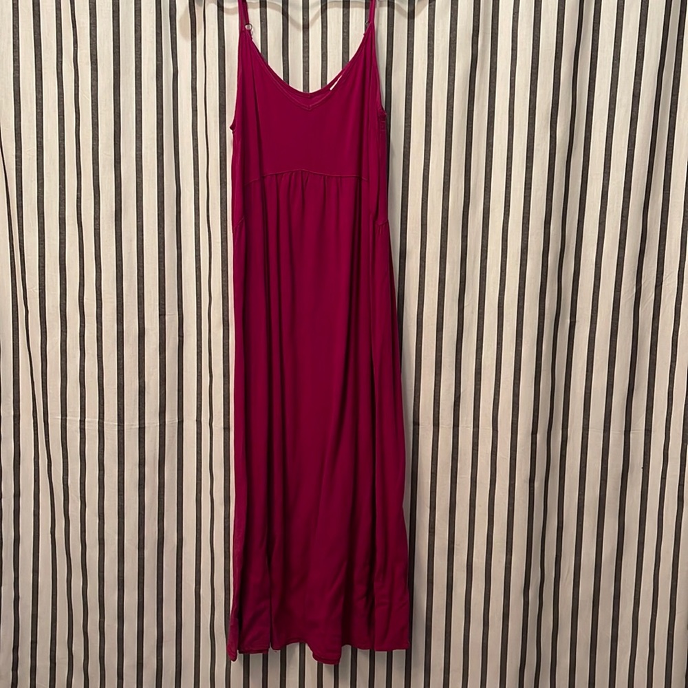 Long deep pink dress.